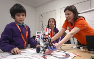 Students a teacher with a robot