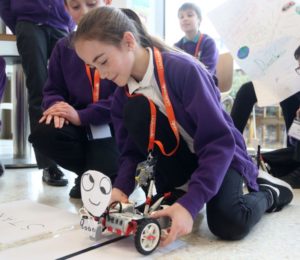 Student with a robot