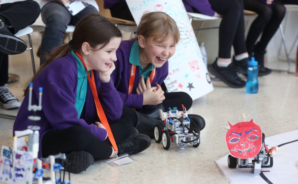 Students observing robot movement